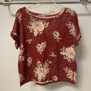 Very thin top. Falls at waist line, so slightly cropped